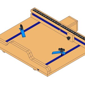 May include: A wooden woodworking jig with a light brown surface, blue rails, and black adjustable clamps. A black and white ruler is mounted on the top edge. The jig is designed for precise cutting and shaping of wood.