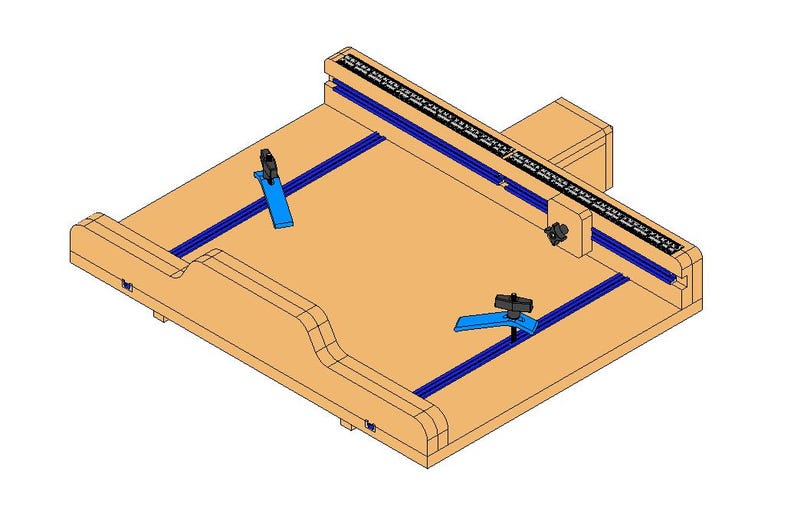 May include: A wooden woodworking jig with a light brown surface, blue rails, and black adjustable clamps. A black and white ruler is mounted on the top edge. The jig is designed for precise cutting and shaping of wood.
