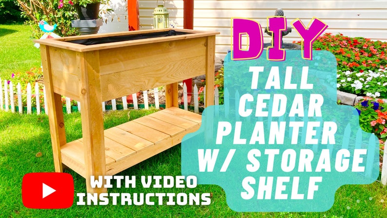 May include: DIY Tall Cedar Planter with Storage Shelf. A wooden planter with a shelf underneath. The planter is made of cedar wood and has a natural finish. The planter is tall and has a rectangular shape. The planter is sitting on a green lawn. The text "DIY Tall Cedar Planter w/ Storage Shelf" is written in pink and yellow letters on a blue background. The text "With Video Instructions" is written in black letters on a red background. A play button is in the bottom left corner.