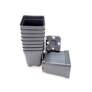 May include: A stack of ten black plastic square plant pots. The pots are ribbed and have drainage holes.