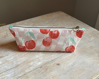 Pouch, bag. Cherries.  Recycled shopping bag.  Approximately 10" x 3-1/4" x 3"  Laminated Material