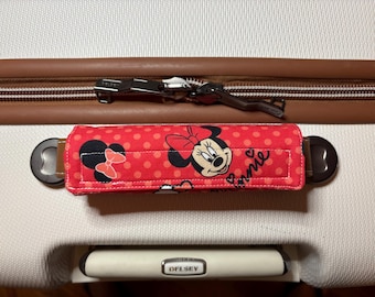 Luggage handle wrap.  Reversible.   Disney.  These make it easy to locate your luggage on baggage belt at airports.  Approx 5-1/2 x 6"