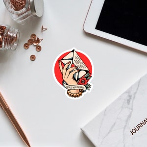 May include: A red circle with a white outline surrounds a hand holding a vintage-style envelope with the text "I'M SORRY THAT YOU WERE ASLEEP WHEN I WROTE THESE WORDS DOWN" and a red flower. The text "HOLD ME DOWN" is below the hand.