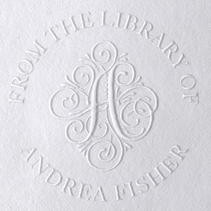 May include: A white embossed circle stamp with the text "From the Library of Andrea Fisher" and a decorative letter "A" in the center.