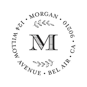 May include: Black and white circular return address stamp with the letter "M" in the center, surrounded by the text "MORGAN, 124 WILLOW AVENUE, BEL AIR, CA 90210".