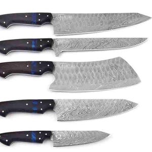 May include: Set of five kitchen knives with dark wood handles and blue accents. The blades are made of Damascus steel and have a wavy pattern.