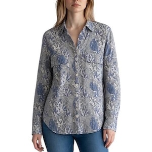 May include: A long-sleeved button-down shirt featuring a repeating pattern of blue and white coral and seaweed motifs on a grey background. The shirt includes a classic collar, a front button placket, and two chest pockets with buttoned flaps.