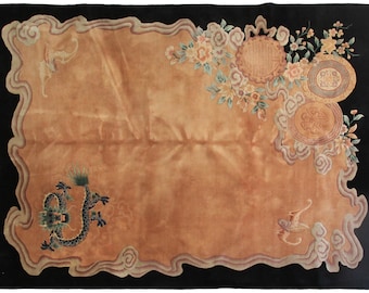 May include: A vintage Chinese rug with a black background and a tan center. The rug features a dragon, flowers, and a circular design with Chinese characters.