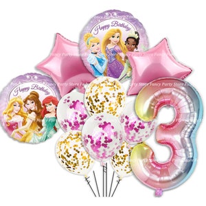 May include: A selection of birthday balloons with Disney princess designs. The set includes star-shaped and round foil balloons with princess illustrations, confetti-filled balloons, and a number 3 balloon. The balloons are in shades of pink, purple, and gold.