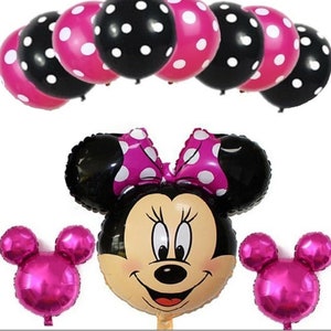 Pu&ograve; includere: Un set di palloncini a pois rosa e neri con un grande palloncino di Minnie Mouse in alluminio e due palloncini pi&ugrave; piccoli a forma di orecchie di Minnie Mouse.