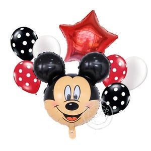 May include: A collection of foil and latex balloons featuring a large central character balloon shaped like a mouse head with black ears and a tan face. The set includes a red star-shaped foil balloon, red and black polka-dot balloons, and solid white balloons.