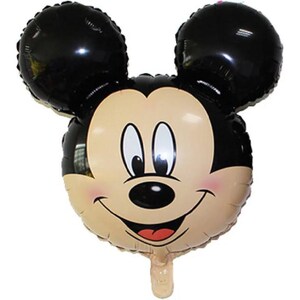 May include: A foil balloon shaped like the head of a cartoon mouse with large black ears, a tan face, black nose, and a wide smiling mouth. The character features white eyes with black pupils and a small red tongue visible inside the open mouth.
