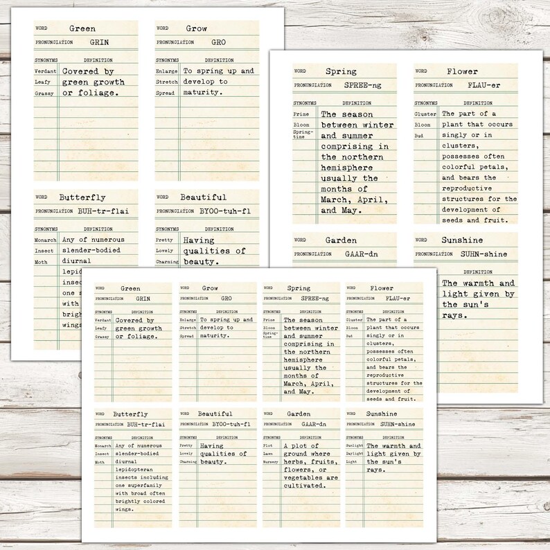 May include: Vintage dictionary flashcards with definitions for words like 'green', 'grow', 'butterfly', 'beautiful', 'spring', 'flower', 'garden', and 'sunshine'. The cards are printed on aged paper with a lined background.
