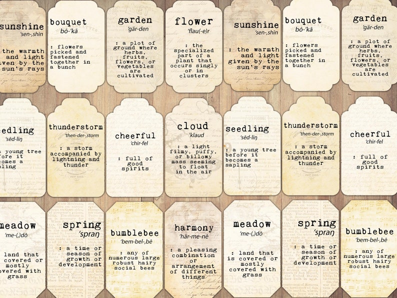 May include: Vintage-style printable tags with nature-themed words and definitions. The tags are cream-colored with a distressed, aged look. Each tag features a different word, such as 'sunshine', 'bouquet', 'garden', 'flower', 'seedling', 'thunderstorm', 'cheerful', 'cloud', 'meadow', 'spring', 'bumblebee', and 'harmony'.