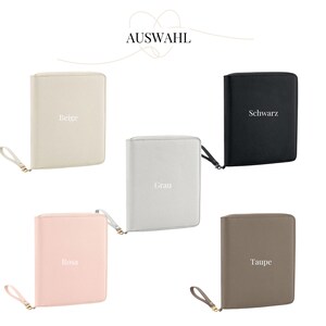 May include: Five different coloured zippered pouches with a gold zipper pull. The pouches are beige, grey, pink, taupe, and black. Each pouch has a different colour word printed on the front: Beige, Grau, Rosa, Taupe, and Schwarz.