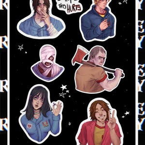 Peut inclure: Ensemble d'autocollants avec des illustrations de personnages variés. L'un des autocollants porte l'inscription « I Hope This Hurts ». Les autocollants sont sur un fond noir avec des étoiles et du texte blancs.