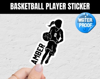 May include: Black and white silhouette sticker of a basketball player dribbling a ball. The sticker says "AMBER" and "8" on the jersey. The sticker is waterproof.