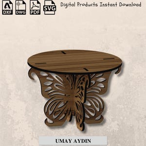 May include: A wooden butterfly-shaped table with a round top and intricate cut-out details. The table is brown with black accents and features the text "UMAY AYDIN" at the bottom. The image also includes file type icons and the text "Digital Products Instant Download."