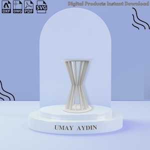 May include: A white digital file design for a stand featuring a central hourglass-shaped structure with vertical slats, displayed on a circular base with the text UMAY AYDIN. Includes DXF, DWG, PDF, and SVG file formats for digital download.