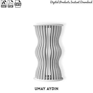 May include: A white cylindrical structure featuring vertical slats with a wavy, hourglass-like profile. The design includes icons for DXF, PDF, and SVG file formats, the text Digital Products Instant Download, and the name UMAY AYDIN at the bottom.