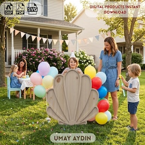 May include: A light-colored wooden cutout in the shape of a seashell, featuring a central panel with radiating curved segments. The item is displayed in a grassy outdoor setting alongside colorful balloons and the text UMAY AYDIN.