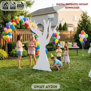 May include: A large white wooden tree cutout standing on a green lawn at an outdoor party. The scene includes a colorful balloon arch, a group of people, and children wearing party hats. Text at the top reads DIGITAL PRODUCTS INSTANT DOWNLOAD.