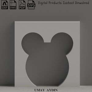 May include: A grey square featuring a cutout of Mickey Mouse's head. The image includes file type icons for DXF, DWG, PDF, and SVG, and the text "Digital Products Instant Download." The name "UMAY AYDIN" is at the bottom.