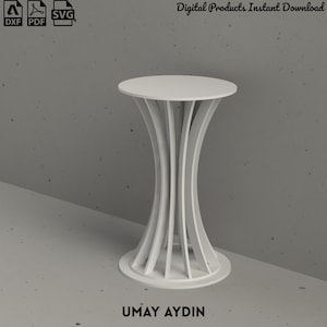 May include: A white circular side table featuring a base constructed from multiple curved vertical slats that connect a round top to a circular floor plate. The design includes digital file icons for DXF, PDF, and SVG formats and the text UMAY AYDIN.