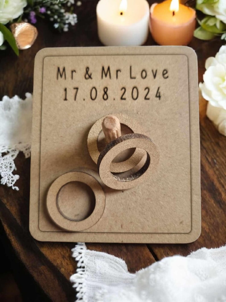 May include: A wooden sign with the text "Mr & Mr Love 17.08.2024" and a wooden ring toss game.