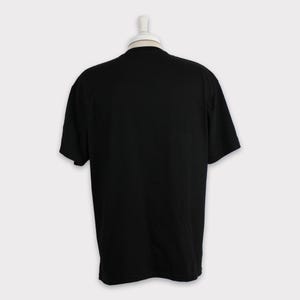 May include: A black short-sleeved t-shirt.