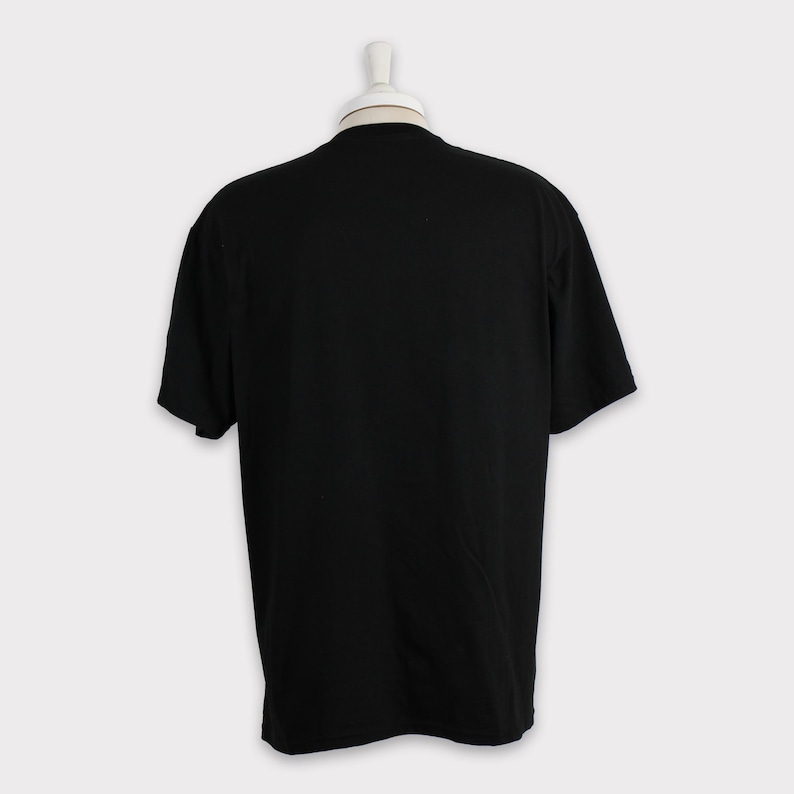 May include: A black short-sleeved t-shirt.