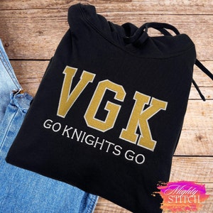 May include: Black hoodie with a gold embroidered VGK logo and the text "GO KNIGHTS GO" underneath.