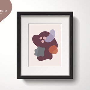 May include: A framed abstract art print with a pink, purple, and brown color scheme. The print features a large, organic shape with smaller shapes inside.