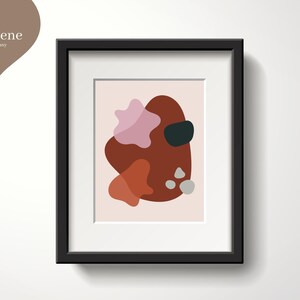 Peut inclure: Impression d'art abstrait avec un cadre noir. L'impression présente un motif abstrait rose, rouge et gris sur un fond rose clair.
