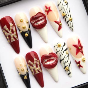 May include: A white ceramic mug with a black handle and the text "But First, Coffee" in a black, bold font. The mug is sitting on a wooden surface.