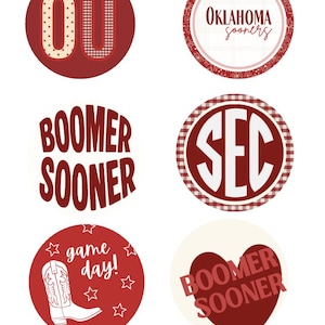 May include: A collection of six circular stickers featuring red and white designs. Elements include the letters OU, the text Oklahoma Sooners, Boomer Sooner, SEC, and game day with a cowboy boot graphic and stars, plus a heart shape with Boomer Sooner.