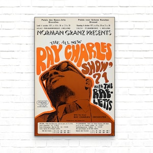 May include: A vintage concert poster for Ray Charles's "The All New Ray Charles Show '71" with the Raeletts. The poster features a close-up of Ray Charles's face in a bright orange and brown colour scheme. The text "Norman Granz Presents" is at the top of the poster.