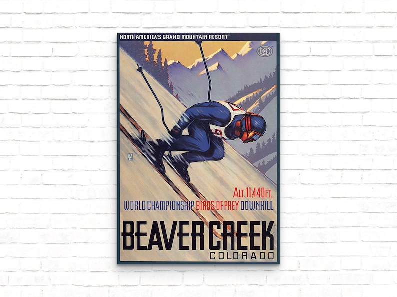 May include: Vintage ski poster featuring a skier racing down a slope with mountains in the background. The poster reads "North America's Grand Mountain Resort", "Alt. 11,440ft.", "World Championship Birds of Prey Downhill", "Beaver Creek", and "Colorado".