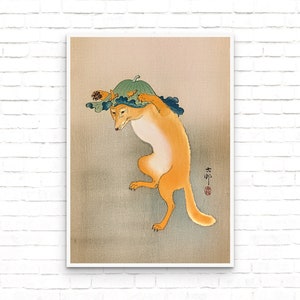 May include: A vintage Japanese woodblock print depicting a fox wearing a gourd on its head. The fox is orange and white, and the gourd is green. The print is on a light brown background.