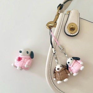 Nyckelringsberlocker med vinterpuffar i täckjacka