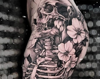 Beautiful, sensual and feminine skull and skeleton body tattoo design with cosmos flowers and leaves. Know its meaning...