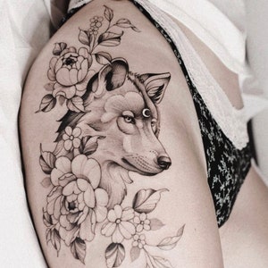 Get this beautiful and sensual Floral Wolf tattoo design. Get a free digital tattoo book as a gift!