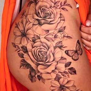 Get now this feminine and sensual butterfly tattoo design with flowers and roses. Get a free digital tattoo book as a gift!