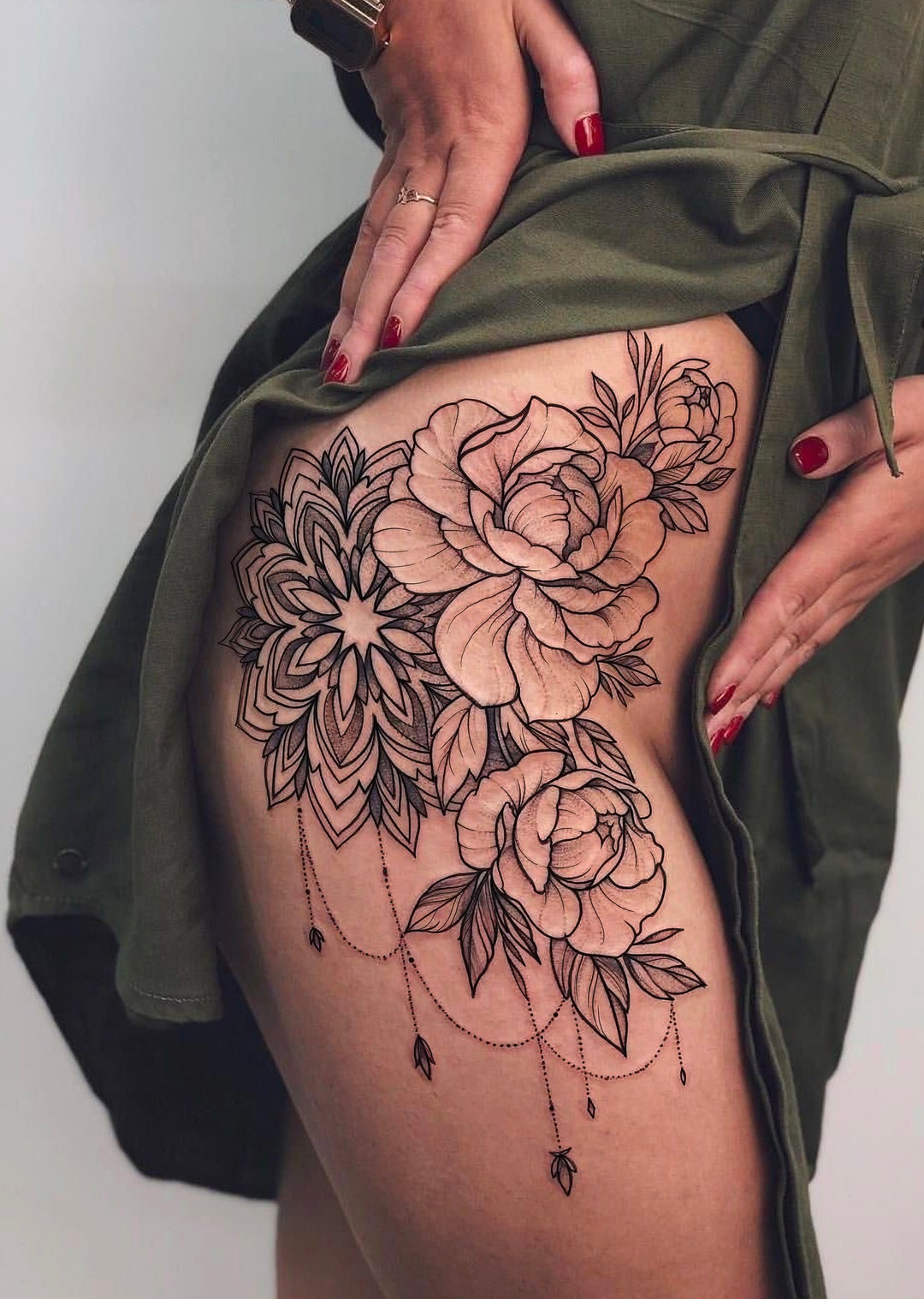 The pattern of curved lines appears almost animated, giving this flower  mandala tattoo a lively appeal | Ratta Tattoo