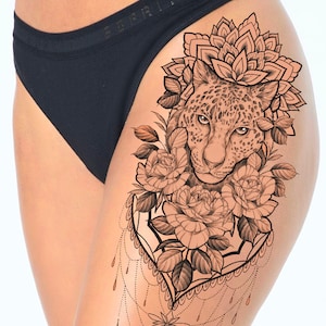 Get now this beautiful and sexy cheetah tattoo design with flowers and mandala, show your sexy and fierce side.