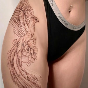 Get now this beautiful tattoo design, unleash your most feminine and brave side, with this beautiful phoenix rising from the ashes