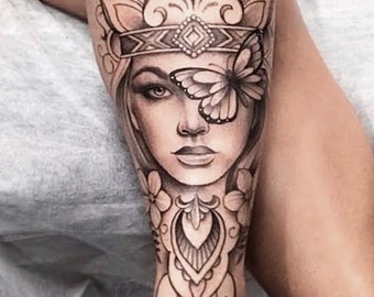 Get now this sensual and feminine tattoo design with woman face, mandala, butterfly, and flowers for leg or arm.