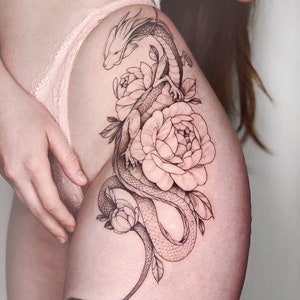 Get this sensual and feminine dragon with flowers design. Show everyone your sexiest side with this tattoo that inspires strength and beauty