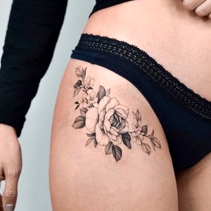 Get now this beautiful and feminine flower tattoo design for the hip and show everyone your most feminine and sensual side