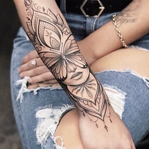 Get now this beautiful and sensual woman&#39;s face tattoo design, whit butterfly and mandalas.